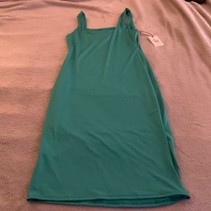 Mint green slimming dress. This dress has minimal stretch and has great quality.